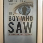 Angela's next book: The Boy Who Saw by Simon Toyne - "Solomon Creed, the mysterious hero introduced in The Searcher, must stop a killer tied to a conspiracy stretching back over generations to the concentration camps and World War II. Solomon Creed has no recollection of who he is, or where he comes from. Lots of twists and turns make this novel a must read! It's the 2nd in a series of three."